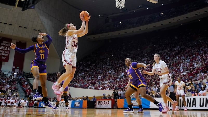 Indiana's Grace Berger (34) shoots against Tennessee Tech's Maaliya Owens (11) during the...