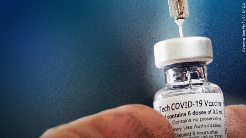 FILE – This photo shows a vial of COVID-19 vaccine.