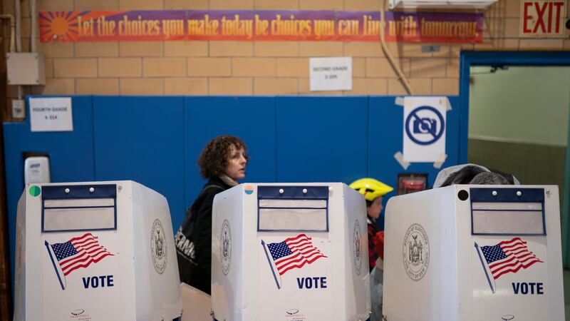 FILE - Voters fill out their ballots at a polling site in the Bedford–Stuyvesant neighborhood,...