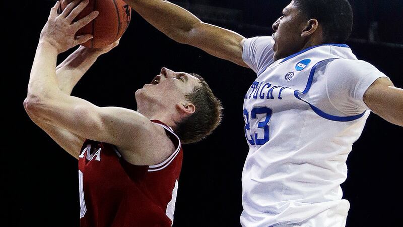 Indiana's Cody Zeller (40) attempts to shoot as Kentucky's Anthony Davis (23) defends during...