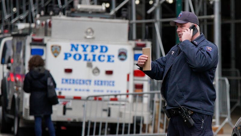 New York Police Department officers of the emergency service unit arrive at the courthouse...