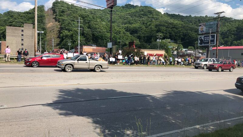 People gathering along 421 in Harlan in protest. Photo Credit: Will Puckett